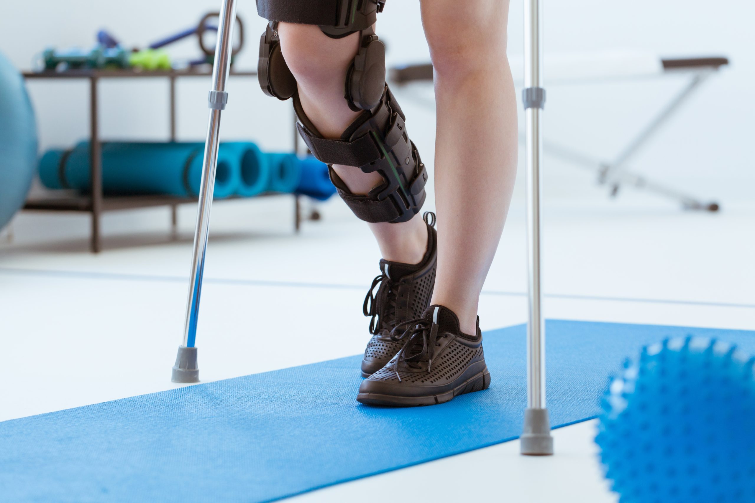 Injured patient walking with brace