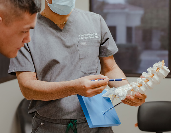 doctor explaining Non-Surgical Orthopedics to a patient