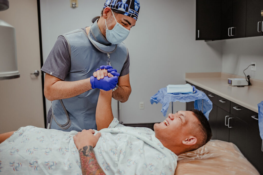 Doctor holding patient hands